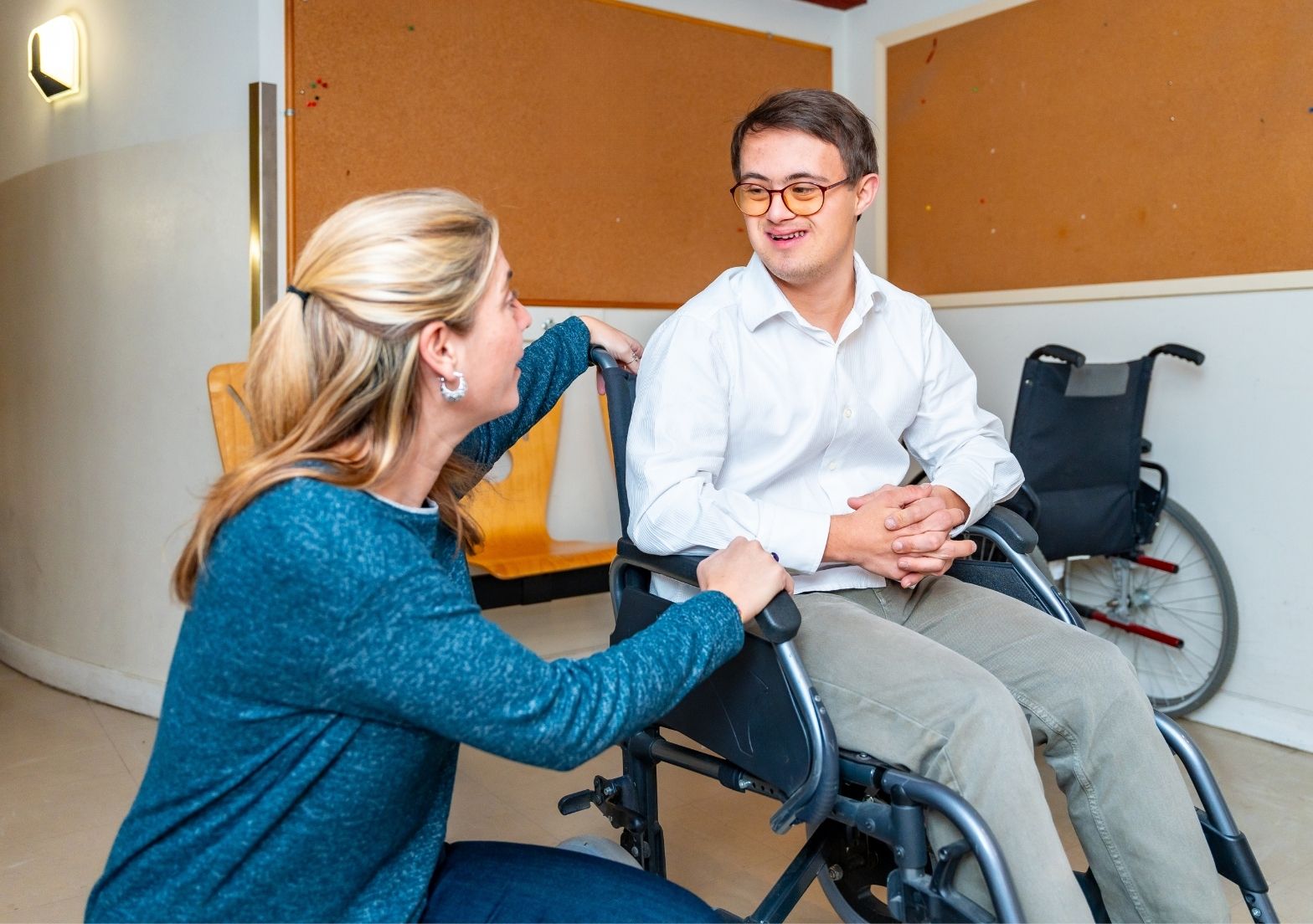 NDIS support worker engaging with participant during a friendly conversation.