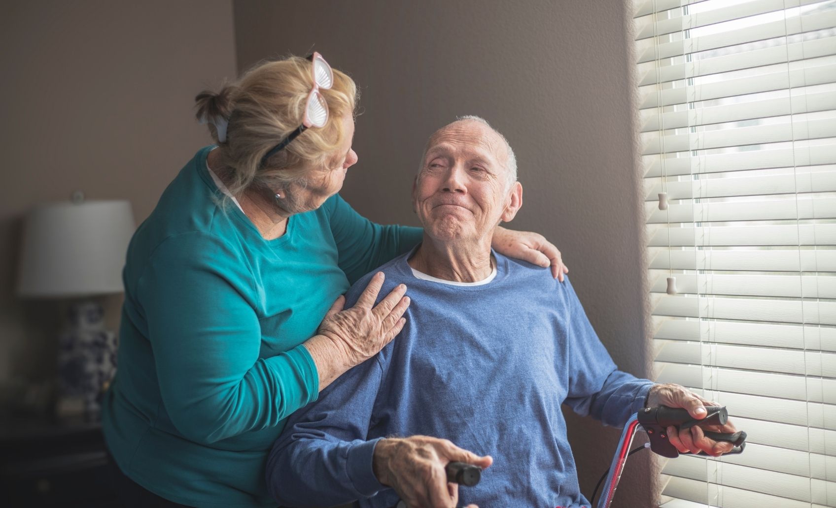 Support worker giving respite care help to aged care participant